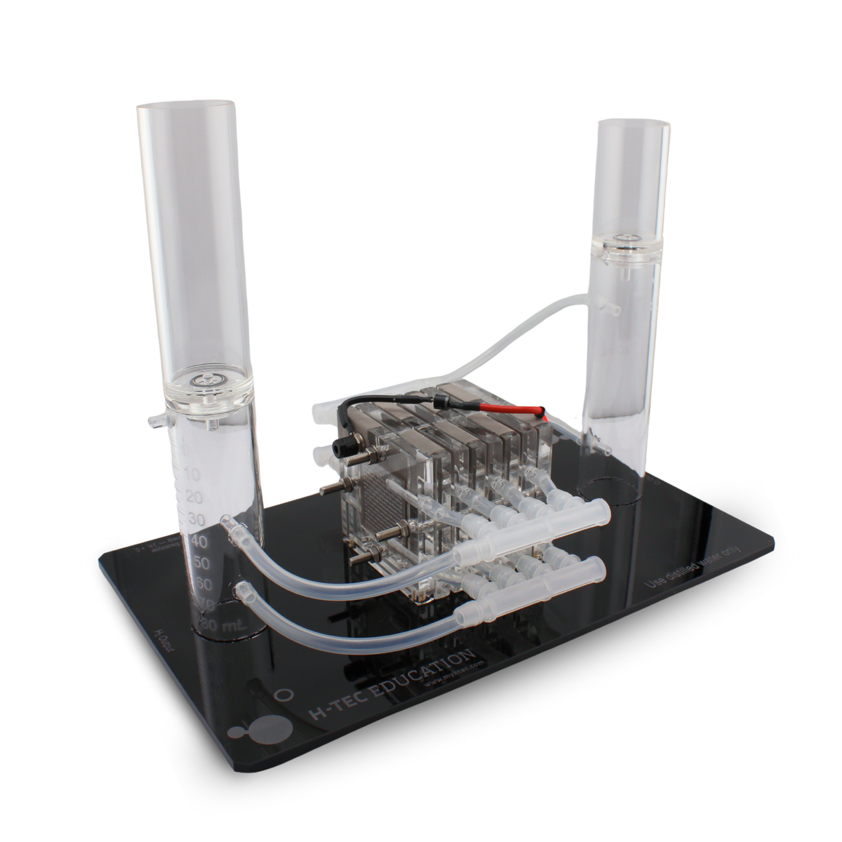 H-TEC Electrolyzer 230 (E207) seven-cell PEM electrolyzer stack with water tank and tubing on base plate, rear view